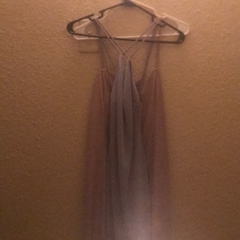 two sparkly shiny short dresses